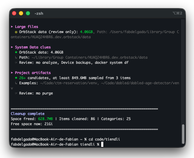 Salida de mo clean en la terminal: archivos grandes, datos de OrbStack, artefactos de proyecto con carpetas venv y 628,7 MB liberados al terminar